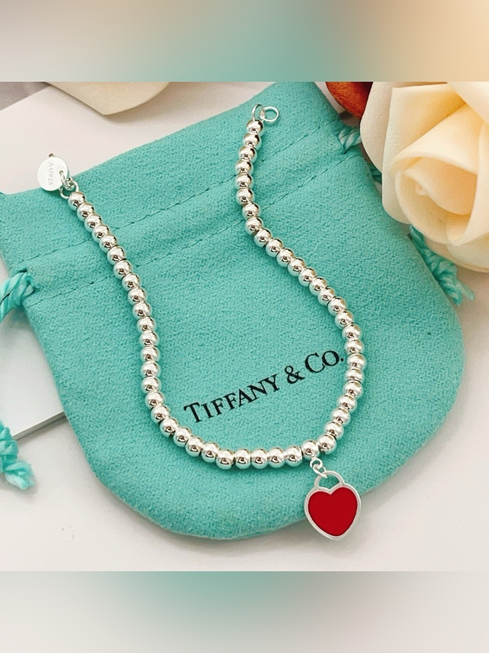 Tiffany & Co. Silver Beaded Bracelet with Red Heart Charm